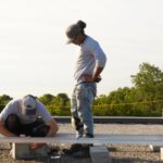 Installers preparing the racking for the solar arrays